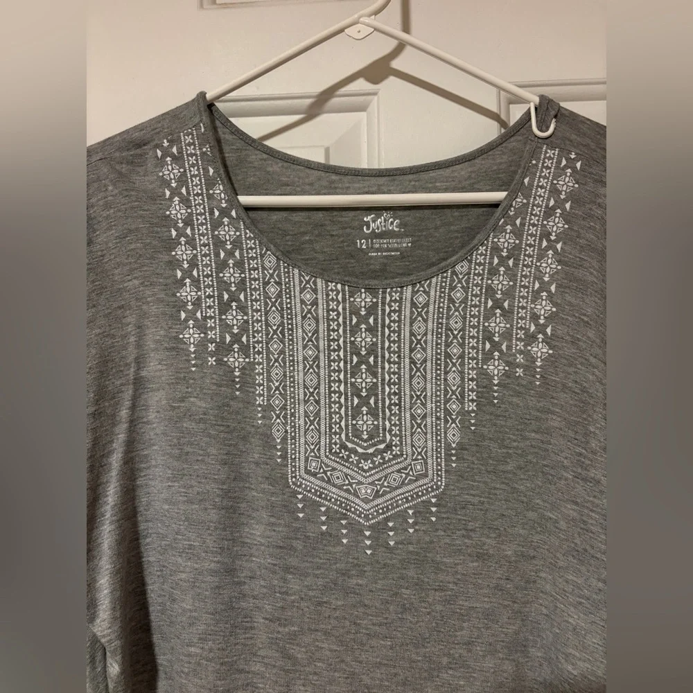 Beautiful Justice top with white decorative detail
